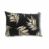 cojin negro con hojas blancas
